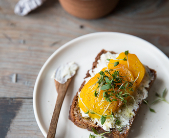 A simple rye bread sandwich with marinated goat cheese and golden beets