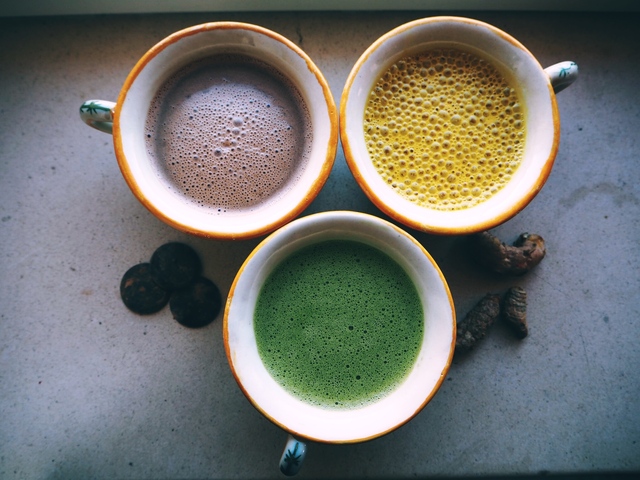 Turmeric latte, hot chocolate and frothy matcha