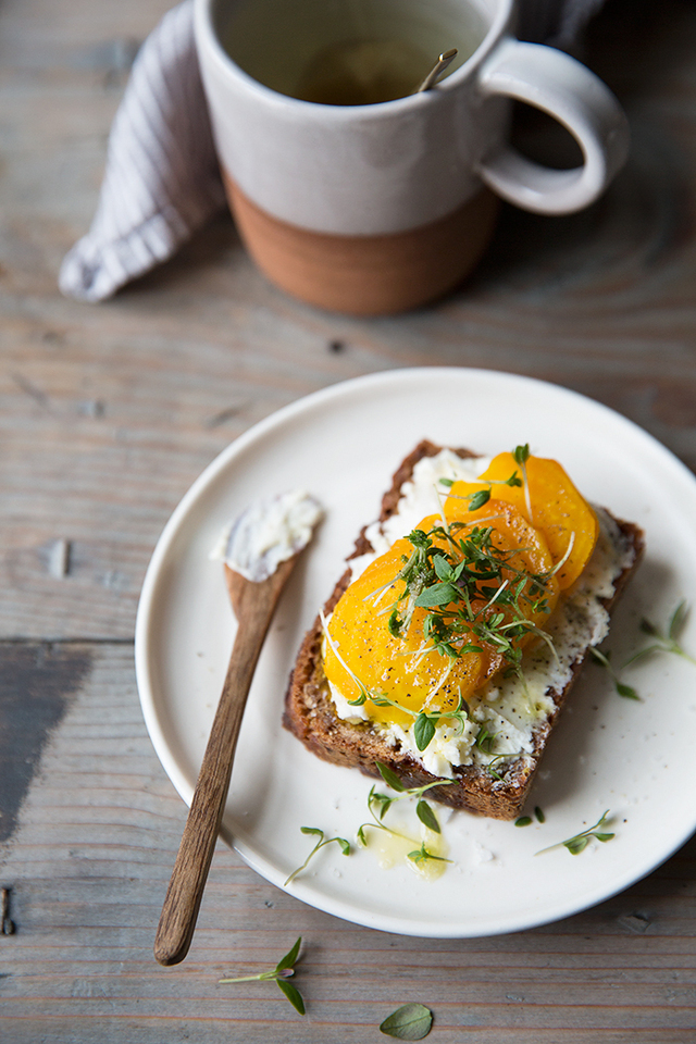 A simple rye bread sandwich with marinated goat cheese and golden beets