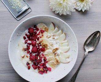 Organic Soygurt Bowl with Pomegranate Seeds, Nuts, Raspberries, and Ginger- & Honey Sauce