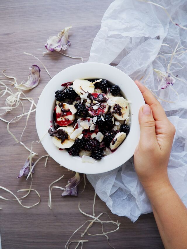 Porridge with Berries, Banana, Coconut Chips & Choco Hazelnut Spread