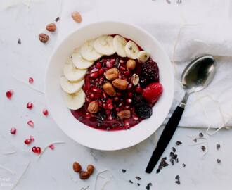 Vegan Acai Bowl with Pomegrante Seeds, Raw Cacao Nibs and Organic Hazelnuts