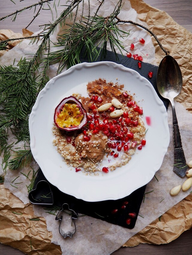 Christmas Porridge with Christmas Fruits like Passion Fruit and Pomegranate, and Raw Almond Butter