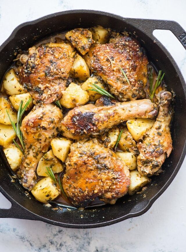 Baked chicken and potatoes in a butter garlic herb sauce, crispy garlic parmesan cr… in 2020 | Baked chicken and potato recipe, Baked chicken, Baked garlic parmesan chicken