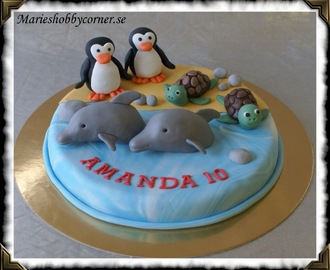 Delfiner, sköldpaddor och pingviner på tårtan