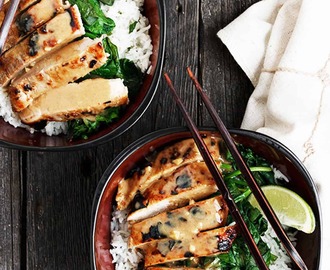 Thai pork tenderloin rice bowl in Asian bowl with chopsticks