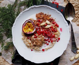 Christmas Porridge with Christmas Fruits like Passion Fruit and Pomegranate, and Raw Almond Butter