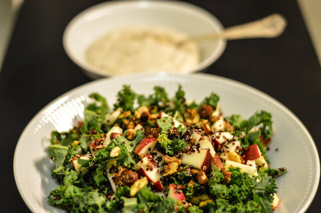 Black quinoa and kale salad with date dressing and spicy nuts