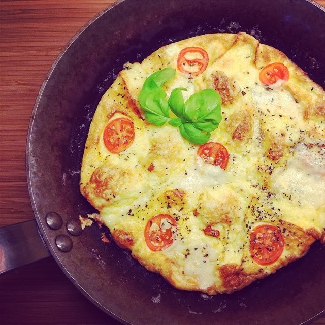 Cheesy omelette with tomato and basil