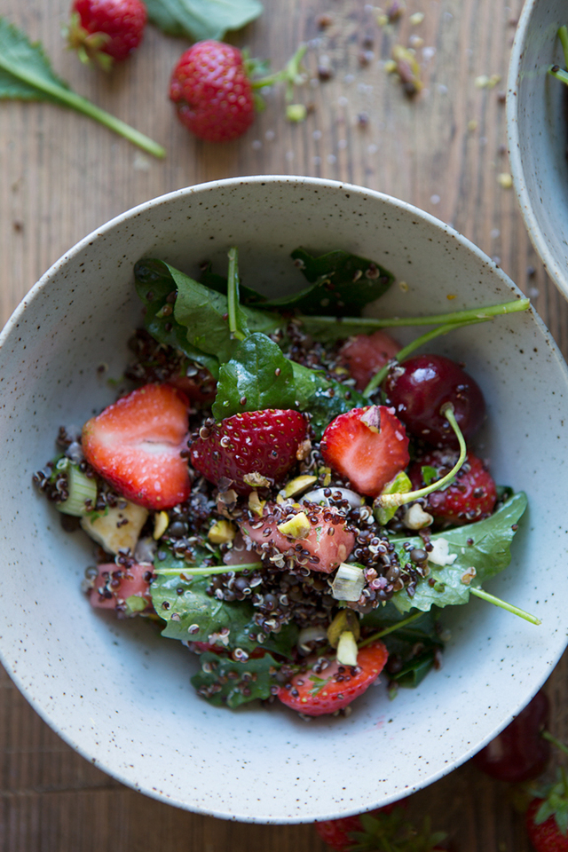 A black quinoa summer salad with baby kale, haloumi, red berries and watermelon