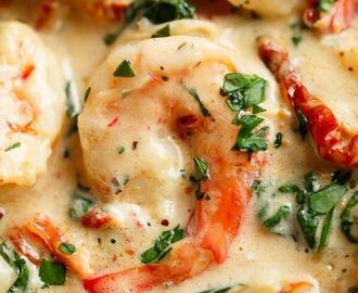 Creamy Garlic Butter Tuscan Shrimp coated in a light and creamy sauce filled with garlic, sun dried tomatoes and spinach! Packed with incred… | Shrimps
