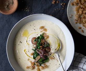 Roasted cauliflower soup with caramelized onions, kale and toasted bread crumbs